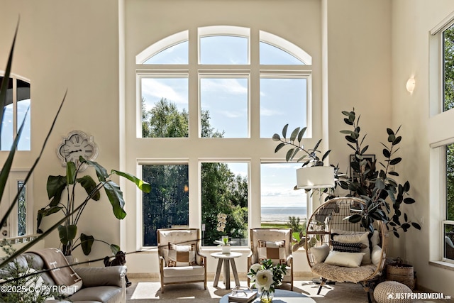 2231 Shore Dr, Anchorage, AK 99515 - living room with a high ceiling, plenty of natural light, and a water view