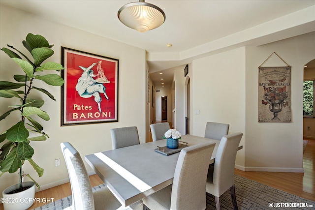 2231 Shore Dr, Anchorage, AK 99515 - dining room with arched walkways and wood finished floors