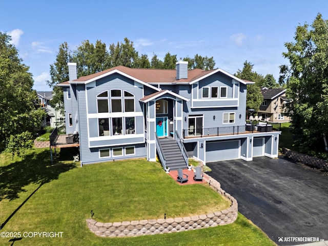 2231 Shore Dr, Anchorage, AK 99515 - bi-level home featuring a chimney, stairs, driveway, a garage, and a front lawn