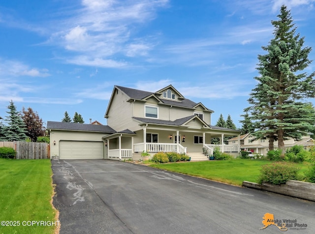 7521 Labrador Cir, Anchorage, AK 99502 - view of front of property with covered porch, asphalt driveway, and a garage