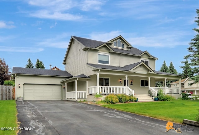 7521 Labrador Cir, Anchorage, AK 99502 - view of front of property with covered porch, asphalt driveway, and an attached garage