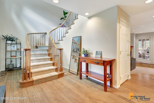 7521 Labrador Cir, Anchorage, AK 99502 - stairs with wood finished floors and recessed lighting