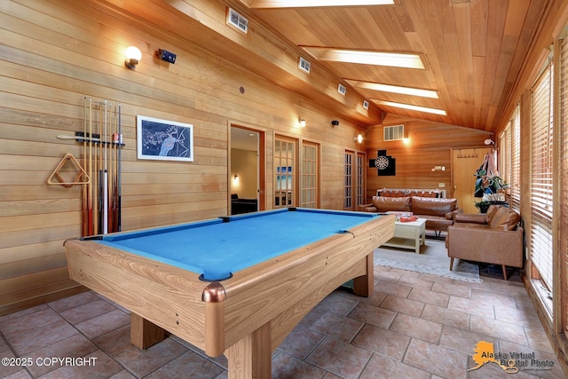 7521 Labrador Cir, Anchorage, AK 99502 - game room with wood walls, wooden ceiling, lofted ceiling, pool table, and stone finish floors