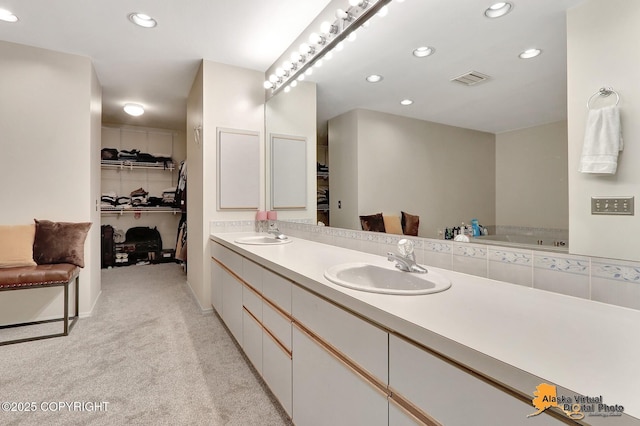 7521 Labrador Cir, Anchorage, AK 99502 - full bathroom featuring double vanity, recessed lighting, and a walk in closet