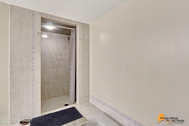 7521 Labrador Cir, Anchorage, AK 99502 - bathroom featuring tiled shower and a bathtub