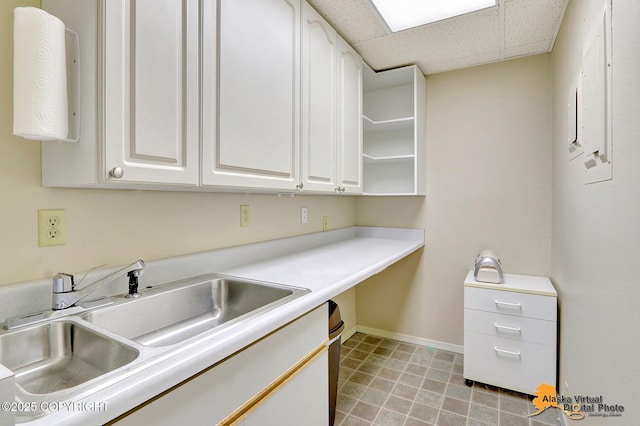 7521 Labrador Cir, Anchorage, AK 99502 - kitchen featuring white cabinets, light countertops, a drop ceiling, open shelves, and electric panel