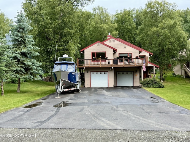 11741 Mary Ave, Anchorage, AK 99515 - chalet / cabin with asphalt driveway, a front lawn, a garage, and a deck