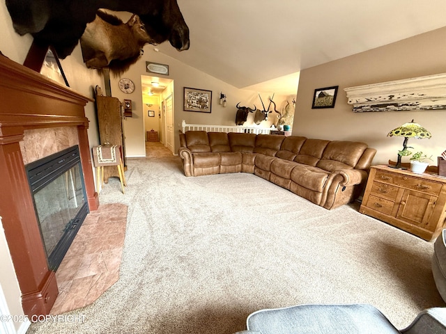 11741 Mary Ave, Anchorage, AK 99515 - living area with light colored carpet, vaulted ceiling, and a glass covered fireplace