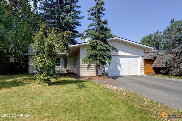 3116 Briarcliff Dr, Anchorage, AK 99508 - view of front facade featuring asphalt driveway, a garage, and a front lawn