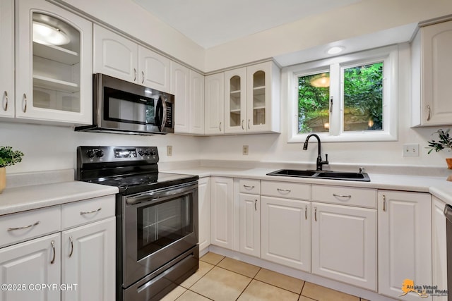 3116 Briarcliff Dr, Anchorage, AK 99508 - kitchen featuring stainless steel appliances, light tile patterned floors, and white cabinetry