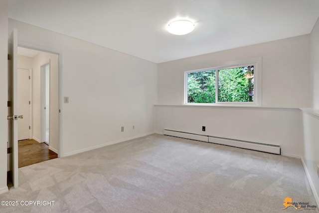 3116 Briarcliff Dr, Anchorage, AK 99508 - carpeted empty room featuring baseboard heating and baseboards