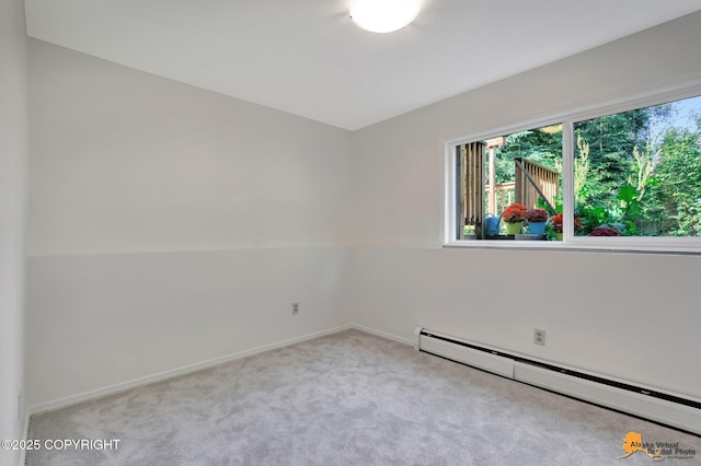 3116 Briarcliff Dr, Anchorage, AK 99508 - empty room featuring a baseboard heating unit and carpet floors