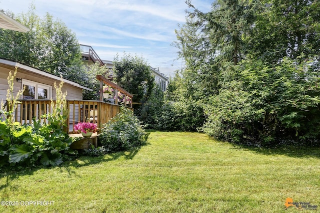 3116 Briarcliff Dr, Anchorage, AK 99508 - view of grassy yard with a wooden deck