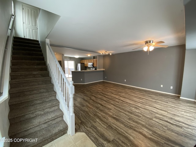 114 Rusty Allen Pl # 31, Anchorage, AK 99504 - unfurnished living room with ceiling fan and stairs