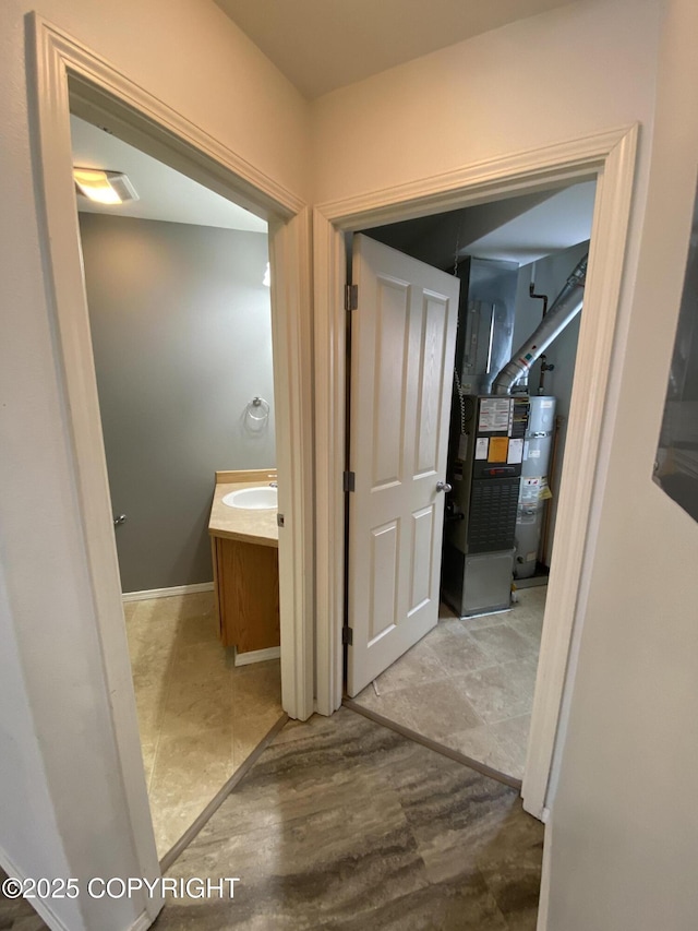 114 Rusty Allen Pl # 31, Anchorage, AK 99504 - bathroom with water heater, vanity, and heating unit