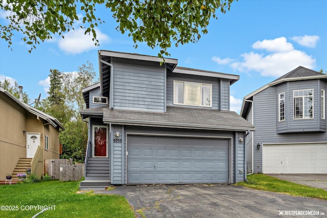 9755 Newhaven Loop, Anchorage, AK 99507 - view of front of house with a garage, asphalt driveway, and roof with shingles