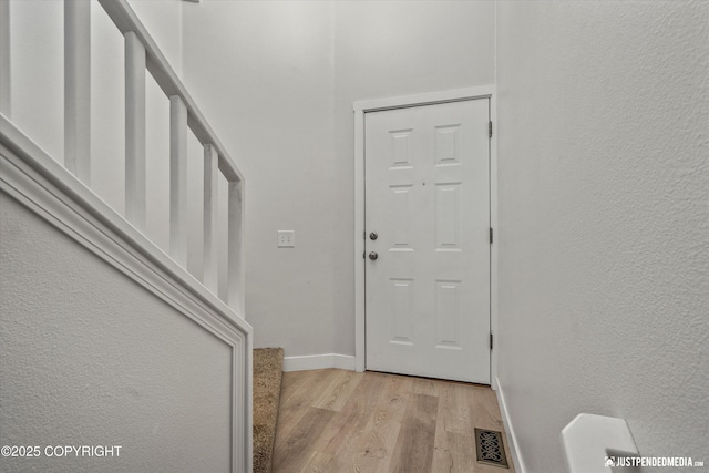 9755 Newhaven Loop, Anchorage, AK 99507 - foyer entrance with light wood-style floors and baseboards