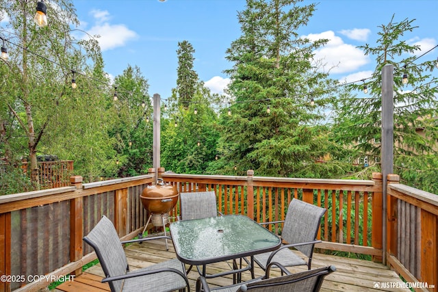 9755 Newhaven Loop, Anchorage, AK 99507 - wooden deck featuring outdoor dining area
