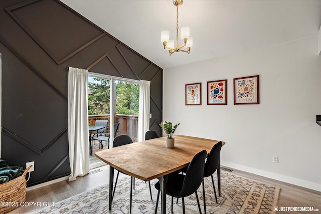 9755 Newhaven Loop, Anchorage, AK 99507 - dining space featuring light wood-style flooring, a chandelier, and vaulted ceiling