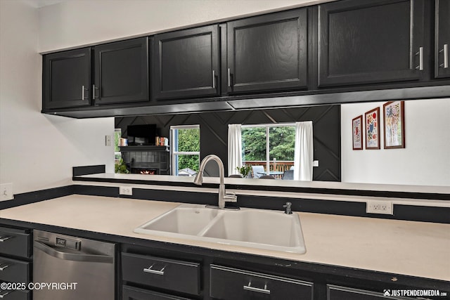 9755 Newhaven Loop, Anchorage, AK 99507 - kitchen with stainless steel dishwasher, dark cabinetry, and light countertops