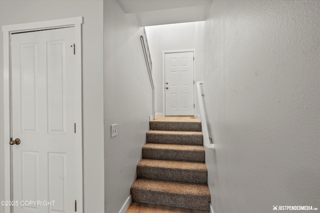 9755 Newhaven Loop, Anchorage, AK 99507 - stairs featuring baseboards and wood finished floors
