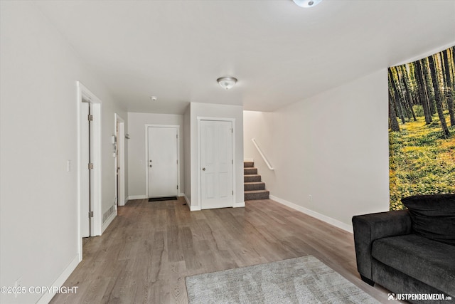 9755 Newhaven Loop, Anchorage, AK 99507 - sitting room with stairway and light wood-type flooring