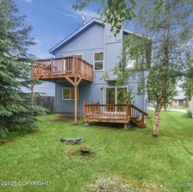 9755 Newhaven Loop, Anchorage, AK 99507 - rear view of property with a wooden deck and a lawn