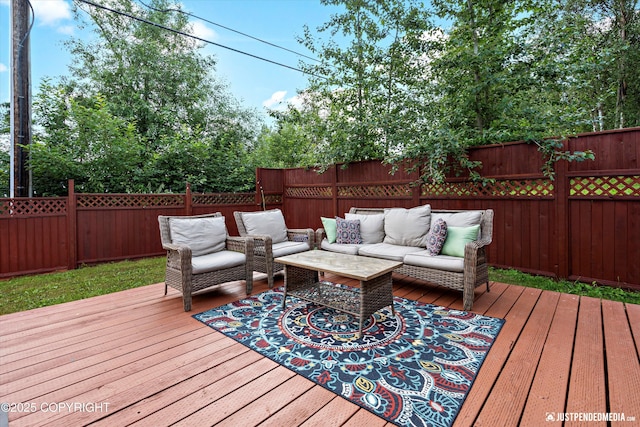 8410 E 20th Ave, Anchorage, AK 99504 - wooden deck with outdoor lounge area and a fenced backyard