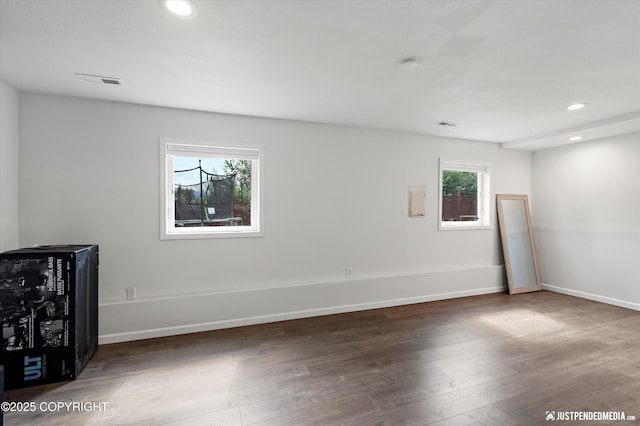 8410 E 20th Ave, Anchorage, AK 99504 - spare room with wood finished floors, recessed lighting, and a smoke detector