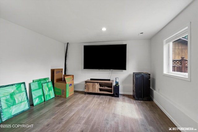 8410 E 20th Ave, Anchorage, AK 99504 - living room featuring wood finished floors and recessed lighting