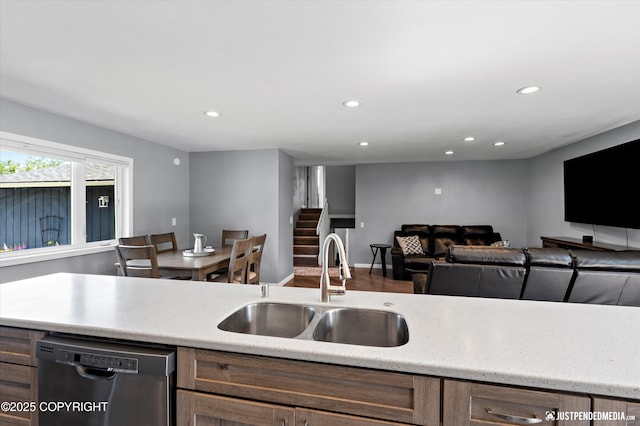 8410 E 20th Ave, Anchorage, AK 99504 - kitchen with stainless steel dishwasher, recessed lighting, light stone countertops, and open floor plan