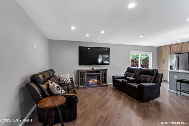 8410 E 20th Ave, Anchorage, AK 99504 - living room with recessed lighting, wood finished floors, and a glass covered fireplace