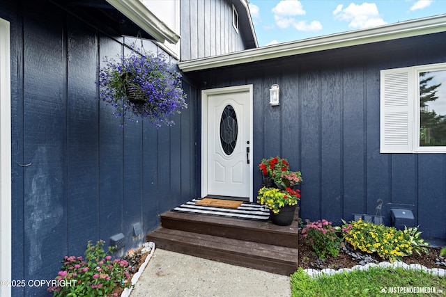 8410 E 20th Ave, Anchorage, AK 99504 - doorway to property with board and batten siding
