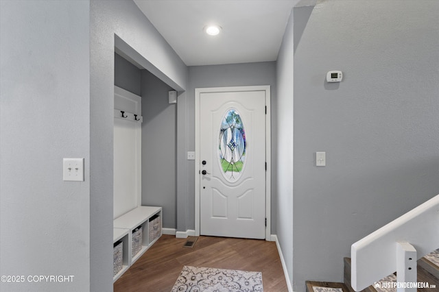 8410 E 20th Ave, Anchorage, AK 99504 - mudroom featuring wood finished floors and baseboards