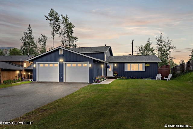 8410 E 20th Ave, Anchorage, AK 99504 - view of front of property featuring an attached garage, driveway, and a shingled roof
