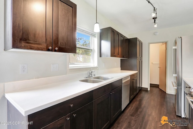 1414 W 7th Ave # 3, Anchorage, AK 99501 - kitchen with appliances with stainless steel finishes, dark wood-style flooring, dark brown cabinetry, light countertops, and rail lighting