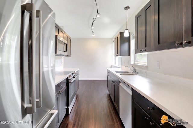 1414 W 7th Ave # 3, Anchorage, AK 99501 - kitchen with appliances with stainless steel finishes, dark wood-style flooring, light countertops, and decorative light fixtures