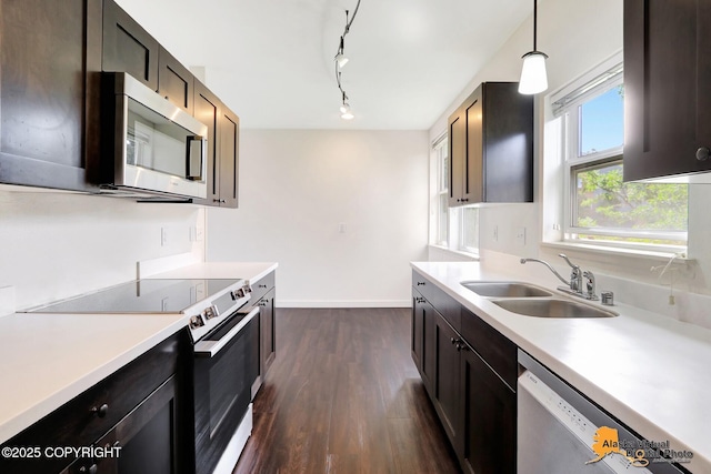 1414 W 7th Ave # 3, Anchorage, AK 99501 - kitchen with appliances with stainless steel finishes, dark wood-type flooring, light countertops, and pendant lighting
