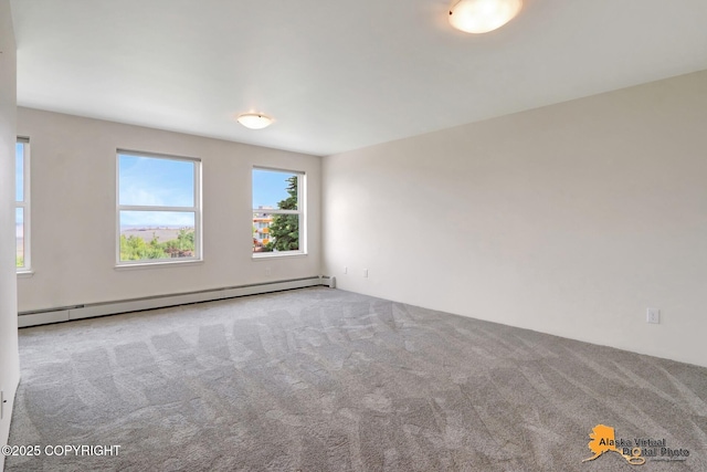 1414 W 7th Ave # 3, Anchorage, AK 99501 - unfurnished room featuring a baseboard heating unit and carpet
