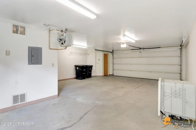 1414 W 7th Ave # 3, Anchorage, AK 99501 - garage with electric panel and a garage door opener