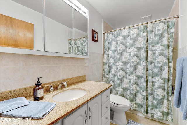 12145 Rainbow Ave, Anchorage, AK 99516 - bathroom featuring tile walls, vanity, and a shower with shower curtain