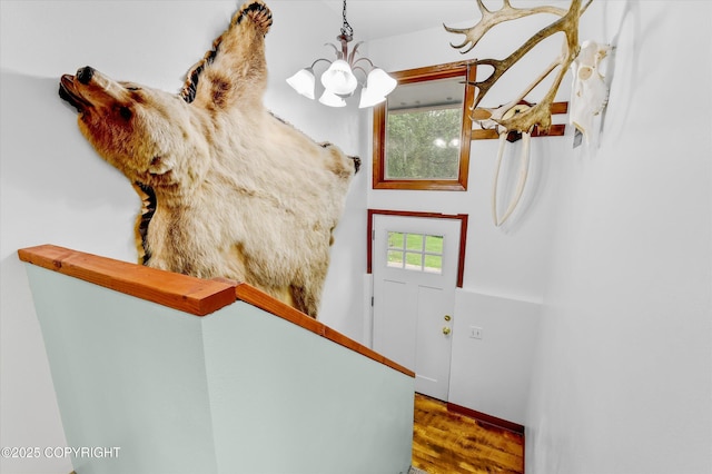 12145 Rainbow Ave, Anchorage, AK 99516 - foyer entrance featuring a chandelier and wood finished floors