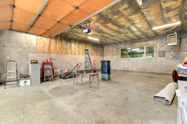 12145 Rainbow Ave, Anchorage, AK 99516 - garage featuring a garage door opener, a heating unit, and electric panel