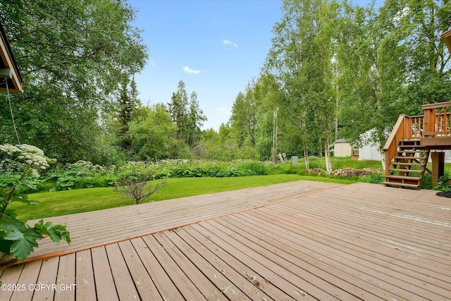 12145 Rainbow Ave, Anchorage, AK 99516 - wooden terrace featuring stairs, a yard, and view of wooded area