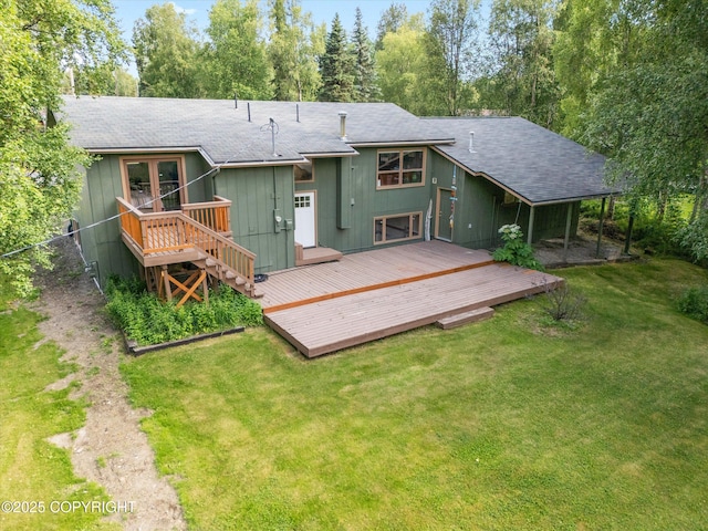 12145 Rainbow Ave, Anchorage, AK 99516 - rear view of house featuring roof with shingles, a wooden deck, and a lawn