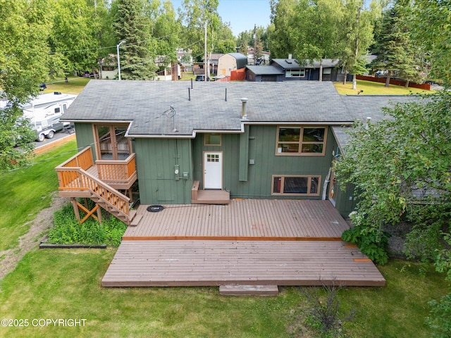 12145 Rainbow Ave, Anchorage, AK 99516 - back of property featuring a deck, a shingled roof, a yard, and stairway