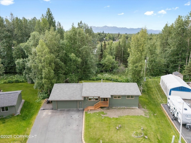 12145 Rainbow Ave, Anchorage, AK 99516 - view of subject property with a forest and mountains