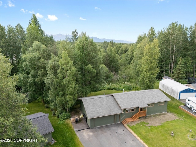 12145 Rainbow Ave, Anchorage, AK 99516 - view from above of property featuring a heavily wooded area and mountains