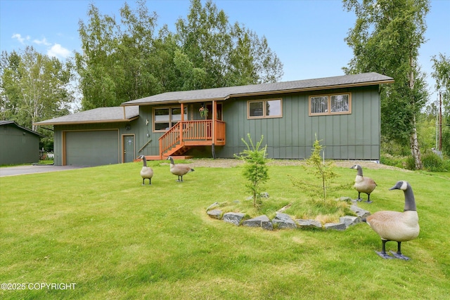 12145 Rainbow Ave, Anchorage, AK 99516 - ranch-style home with a garage, driveway, a front lawn, and board and batten siding