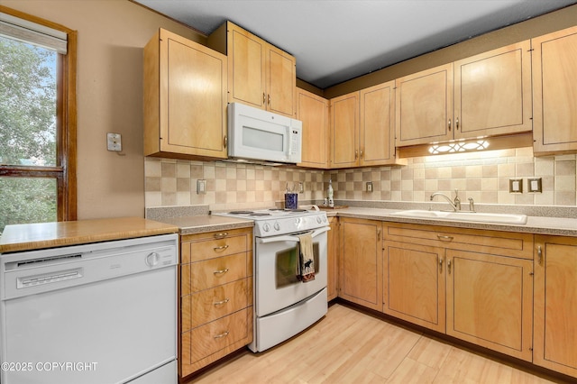 12145 Rainbow Ave, Anchorage, AK 99516 - kitchen with white appliances, decorative backsplash, light countertops, and light brown cabinetry